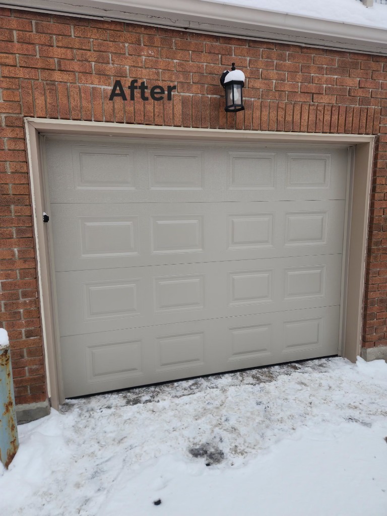 Beige raised-panel garage door after panel repair on a Stittsville brick home in winter