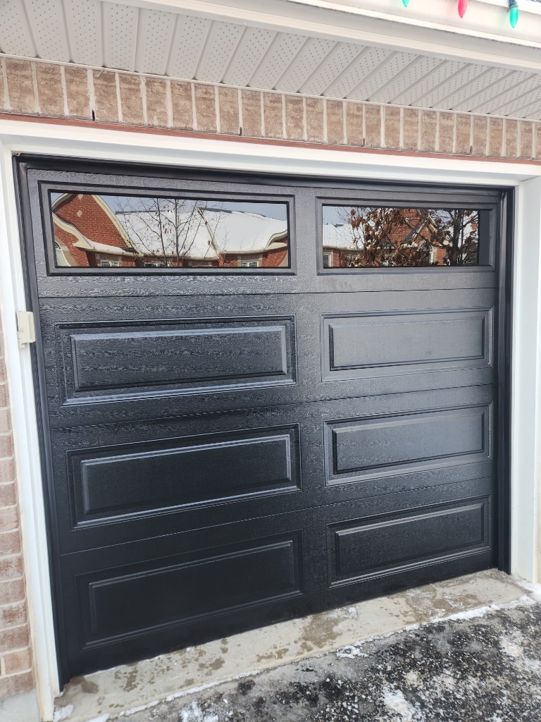 Worn vs new nylon garage door rollers during tune-up in Stittsville
