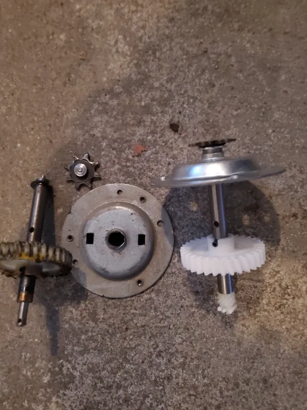 Stripped opener drive gear, sprocket, and worm gear from a Stittsville opener repair
