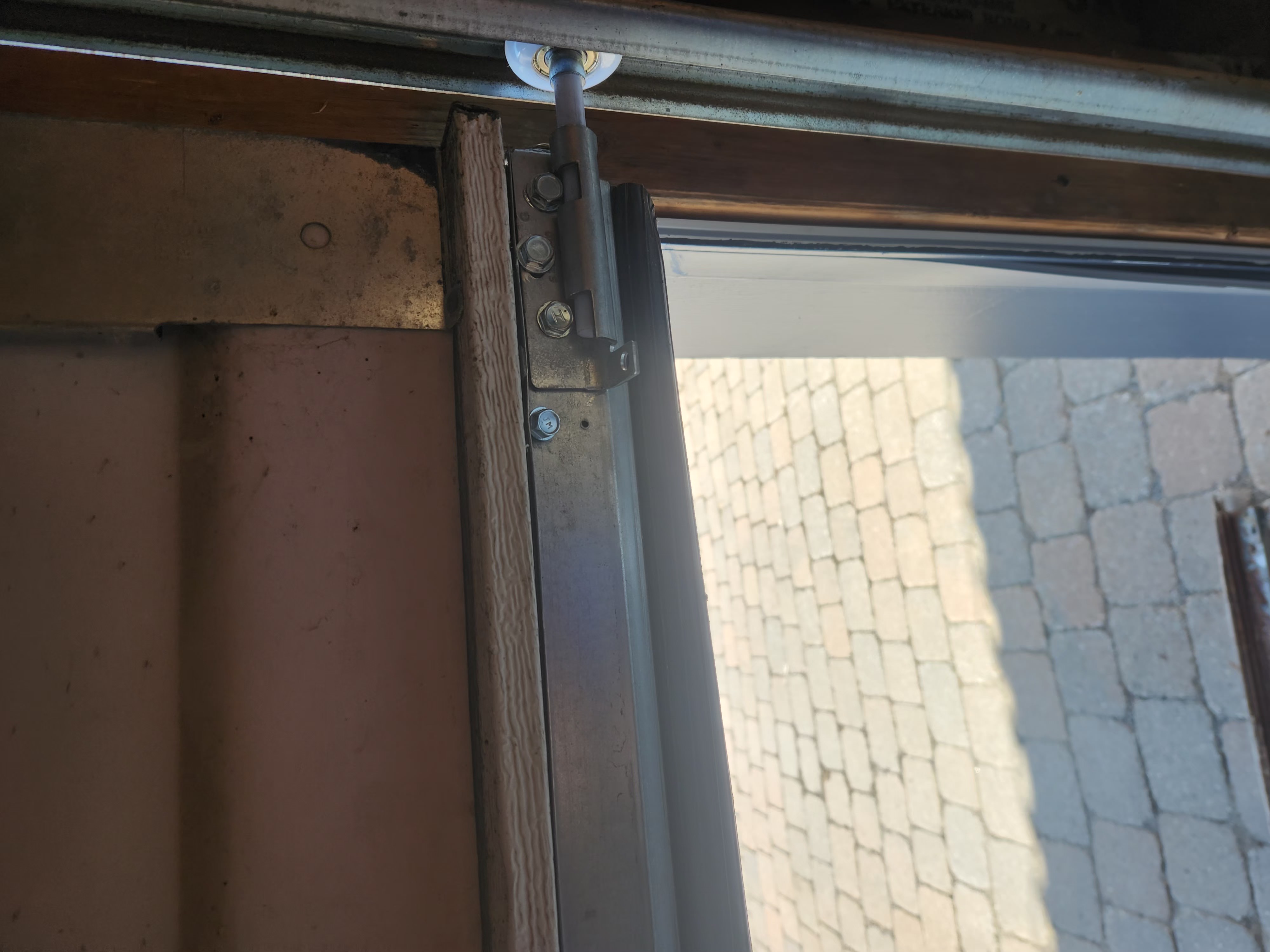Wayne Dalton retainer with new bottom seal, lift cable, nylon roller, and bottom bracket on a Stittsville garage door
